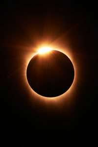 The golden ring of a total eclipse shine in the dark. 