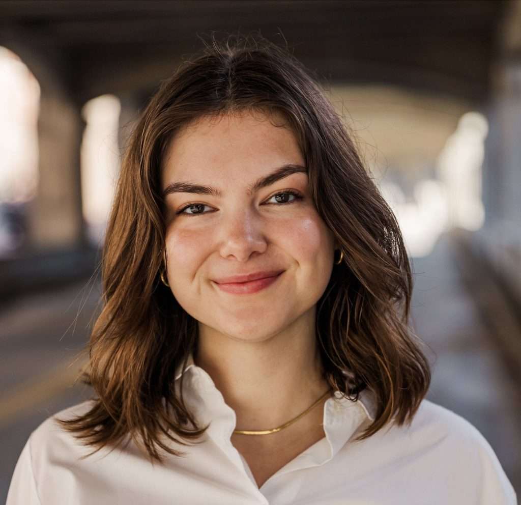 headshot of a women with shoulder-length brown hair and brown eyes