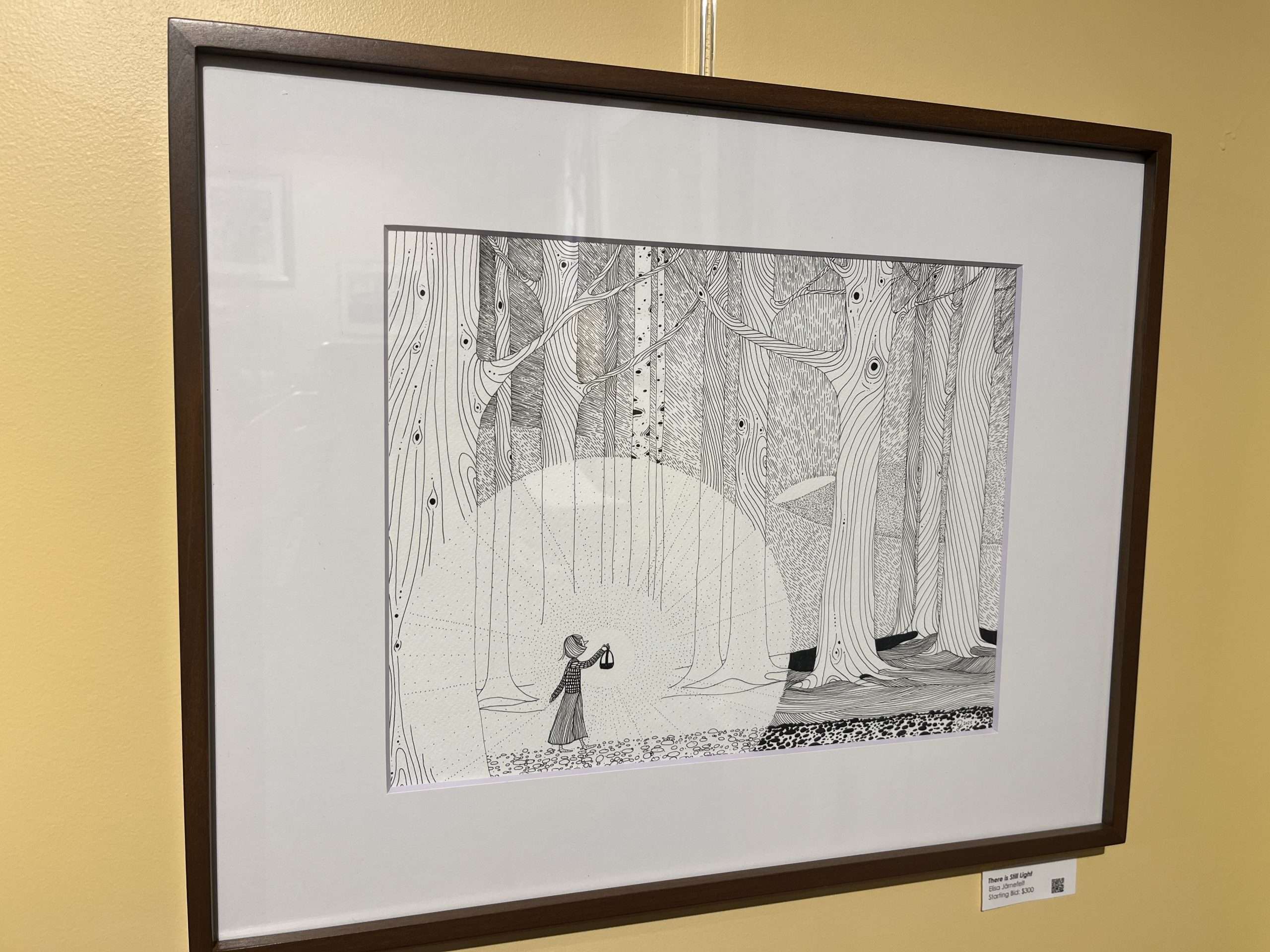 “There is Still Light” by Elisa Järnefelt, a pen and ink illustration of a figure in a forest.
